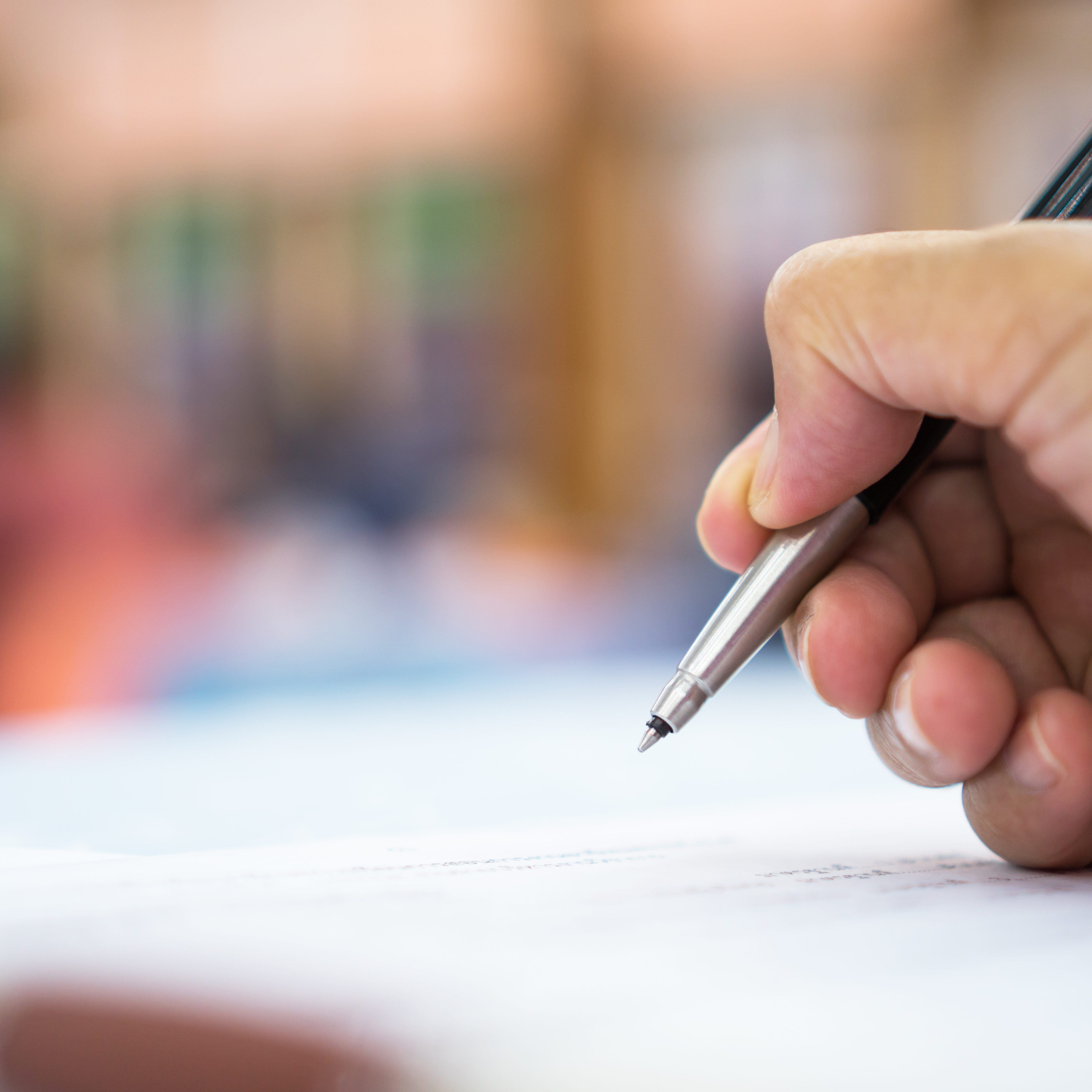 Asian Business man Manager checking and signing applicant fillin Asian Business man Manager checking and signing applicant filling documents reports papers company application form or registering claim in meeting room office. Document Report business Concept